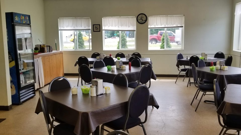 Quiet dining space set for breakfast and lunch.